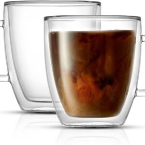 Two double-wall glass mugs with clear handles, one filled with coffee swirling with cream and the other empty. The insulated design highlights heat retention while keeping the outer surface cool to the touch.