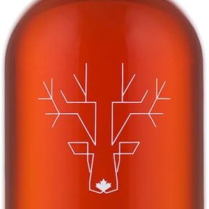 A bottle of Escuminac Extra Rare organic Canadian maple syrup, filled with rich amber syrup and sealed with a white cap. The minimalist label features a geometric white deer head with a small maple leaf at the base, emphasizing its Canadian origin and premium quality.