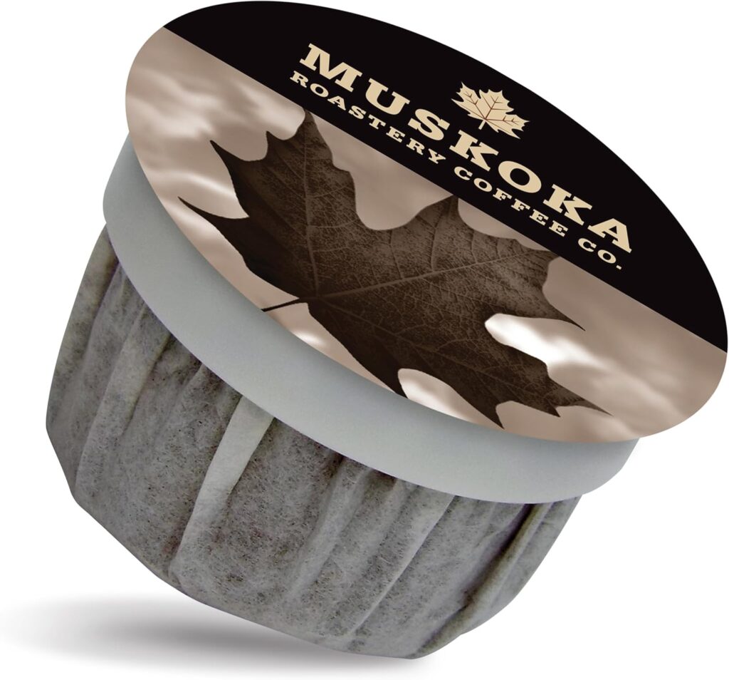 Single-serve coffee pod from Muskoka Roastery Coffee Co. featuring a sepia-toned maple leaf design on the lid and bold text reading "Muskoka Roastery Coffee Co." The packaging reflects the brand’s signature Maple Roast coffee, tying into its Canadian heritage and natural flavor profile.