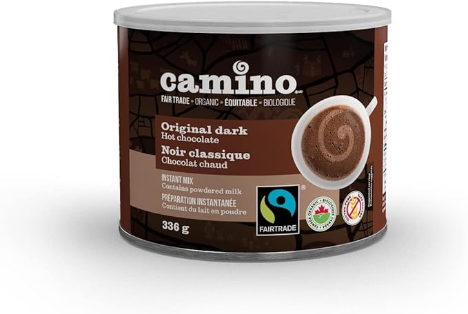 Alt text: Canister of Camino Original Dark Hot Chocolate with bilingual labeling in English and French, highlighting it as an organic fair trade hot chocolate made with powdered milk. The packaging features certification logos for Fairtrade and Canadian organic standards, along with an image of a steaming cup of hot chocolate.