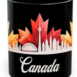 Black ceramic mug featuring a white silhouette of the Toronto skyline set against vibrant red, orange, and yellow maple leaves, with “Canada” written in cursive at the bottom. This bold, easy-to-hold design makes it a thoughtful and patriotic option in the best coffee gifts for seniors.
